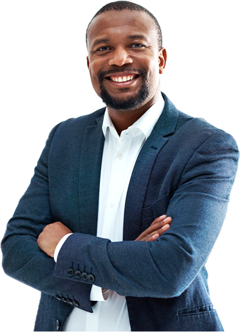 Portrait of a mature businessman standing in an office smiling with his arms folded facing the camera